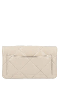 Tory Burch women’s Kira wallet beige cream-colored quilted leather clutch with front flap and diamond-stitched pattern