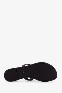 Tory Burch women’s brown leather thong sandal with minimalist design and subtle branding on the insole