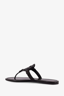 Black patent leather Tory Burch women’s miller thong sandal with signature logo buckle and brown leather sole