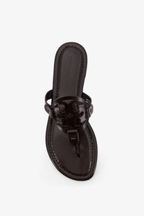 Black patent leather tory burch sandals with signature logo medallion and thong strap for women