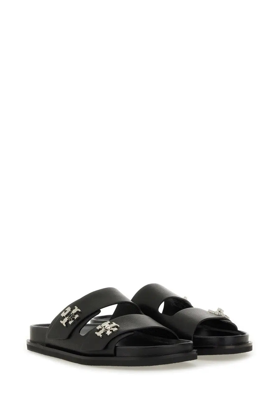 Black leather slide sandals with silver-tone Tory Burch logo embellishments for women