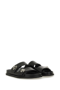 Black leather slide sandals with silver-tone Tory Burch logo embellishments for women