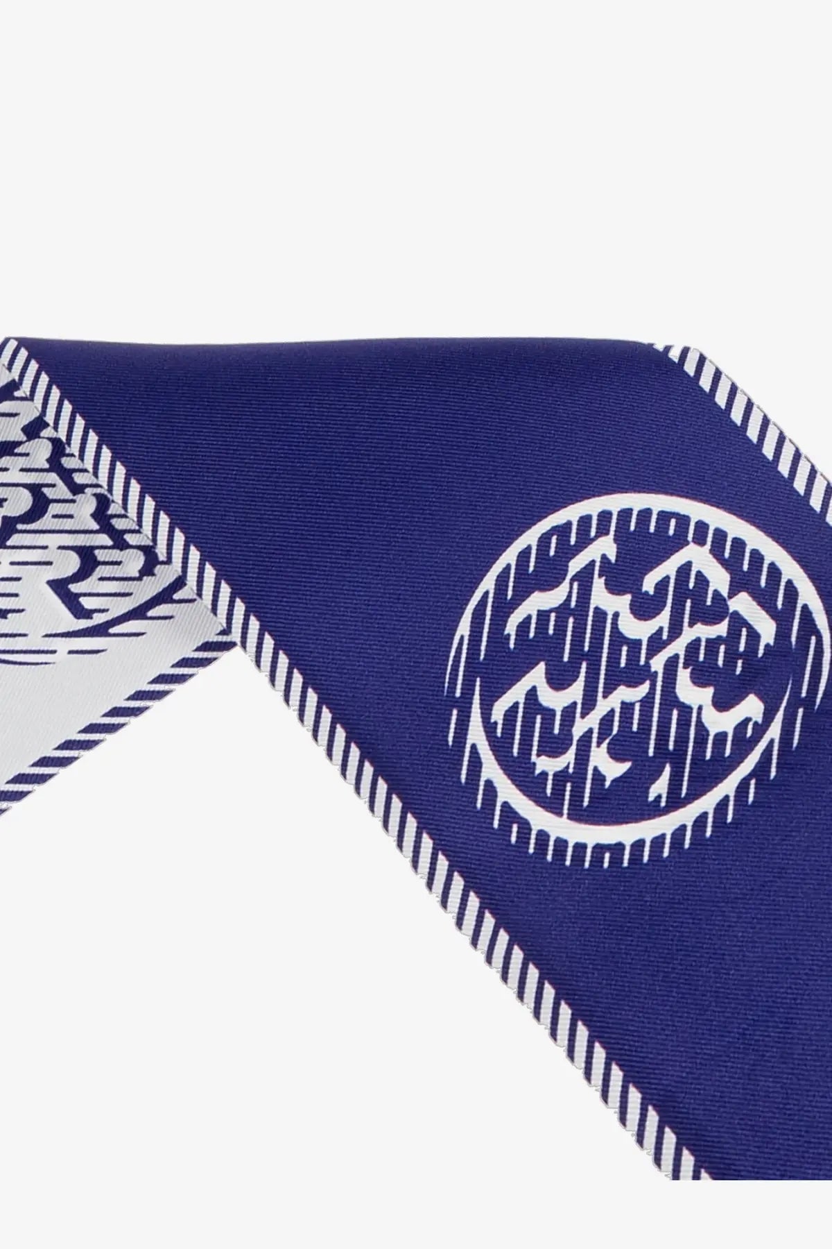 Tory Burch women’s medallion ribbon silk tie blue deep blue silk scarf with bold white geometric circular emblem and striped edge