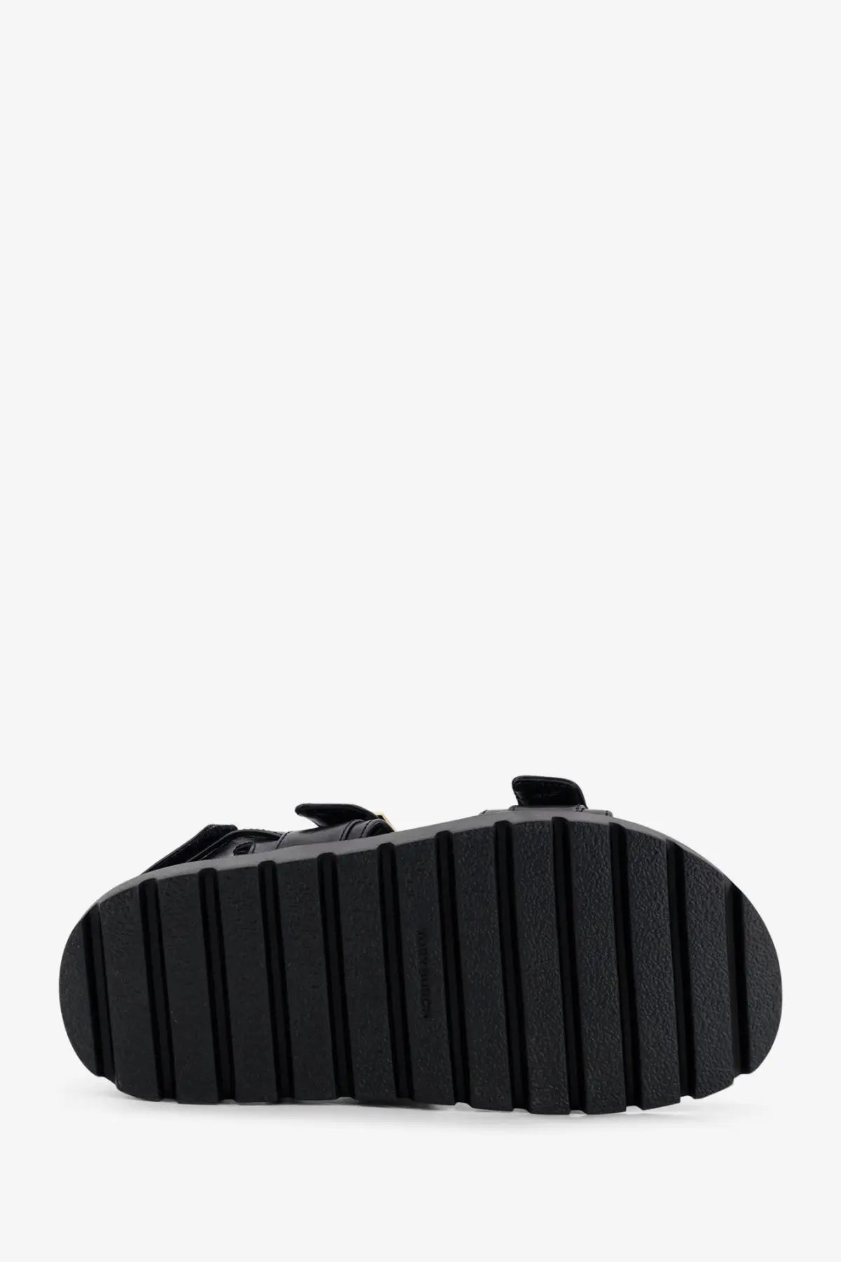 Black rubber sole with vertical ridges on the back of tory burch women’s mellow leather sandals black