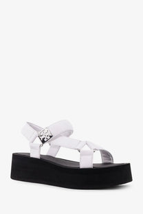 White leather Tory Burch womens mellow wedge sandals with black sole and silver-tone logo buckle