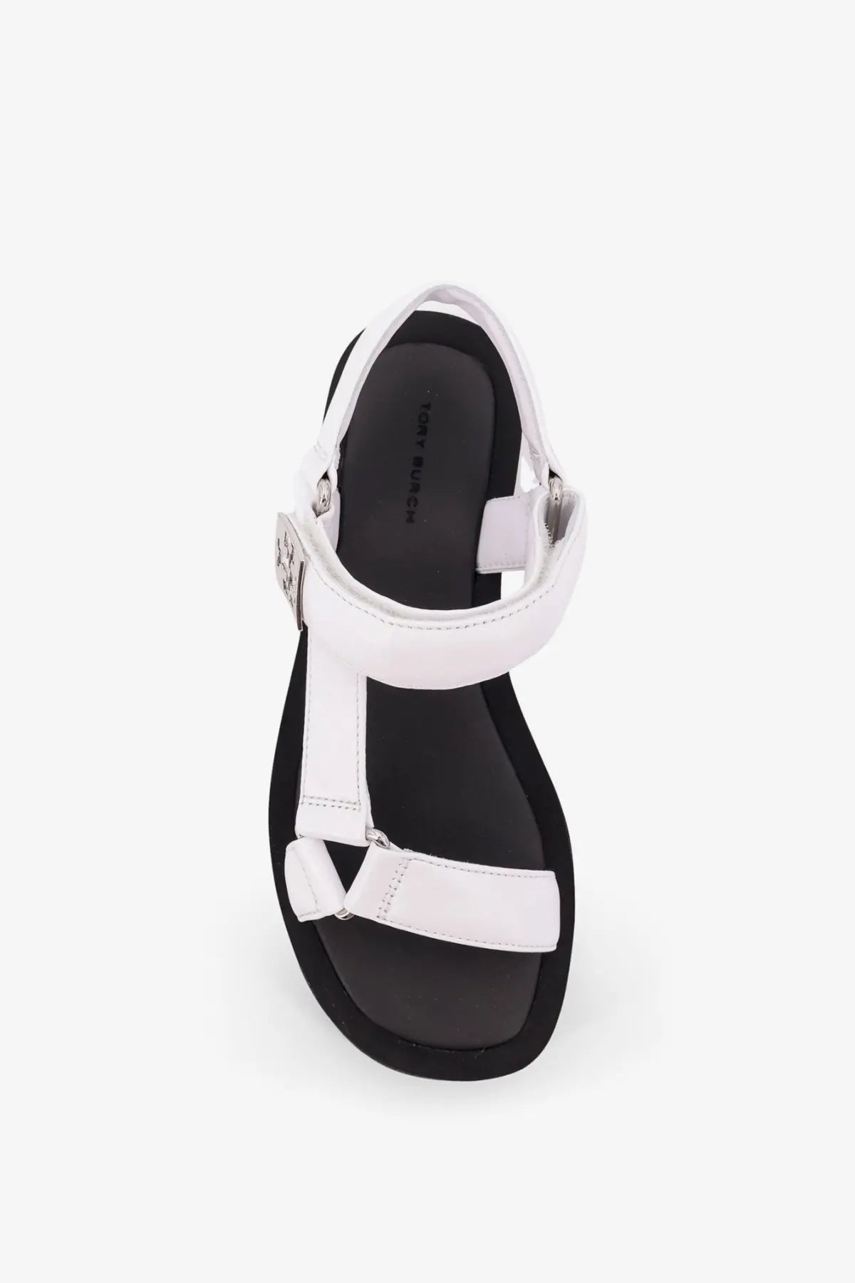 Tory Burch women’s mellow leather wedge sandals in white with black sole and silver-toned buckle detail