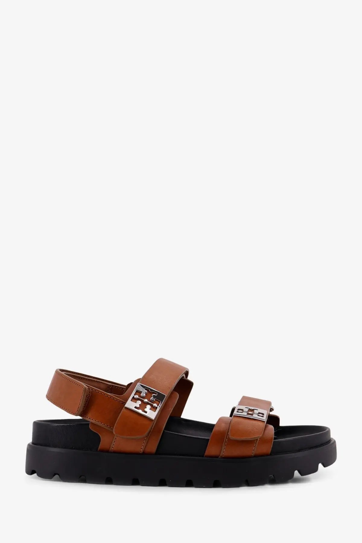 Tory Burch women’s mellow low leather sandals in beige brown with black rubber soles and silver logo buckles