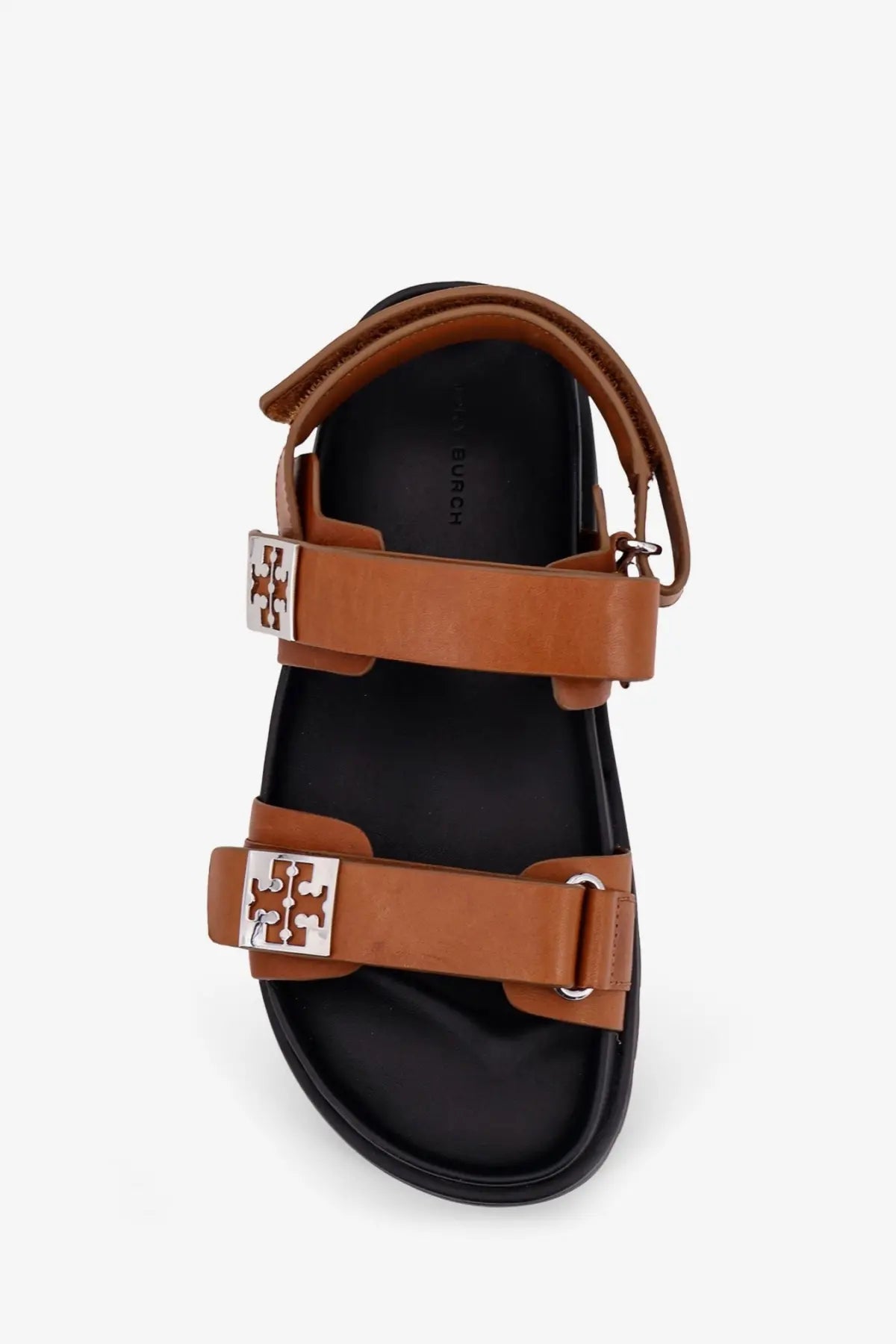 Tory Burch women’s mellow low leather sandals in beige with tan leather straps and silver-tone logo buckles