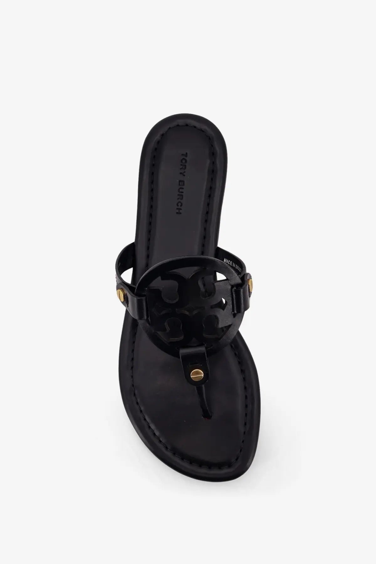 Black patent leather tory burch women’s miller thong sandals with gold-tone circular logo hardware