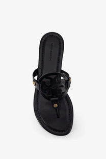 Black patent leather tory burch women’s miller thong sandals with gold-tone circular logo hardware