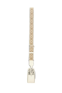 Cream-colored leather tory burch mini miller shoulder bag with monogram strap and silver-tone hardware