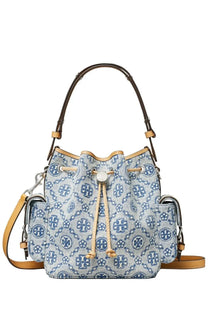 Tory Burch women’s monogram bucket bag in blue and white patterned denim with brown leather handles and straps
