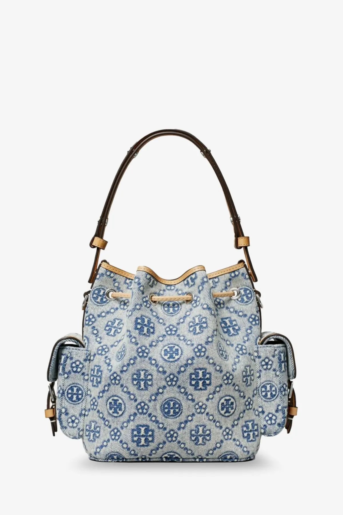 Light blue denim tory burch bucket bag with navy blue monogram pattern and brown leather handles for women