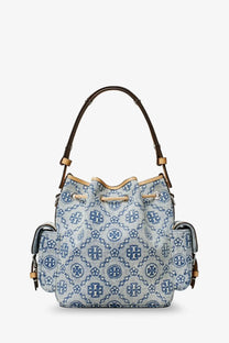 Light blue denim tory burch bucket bag with navy blue monogram pattern and brown leather handles for women