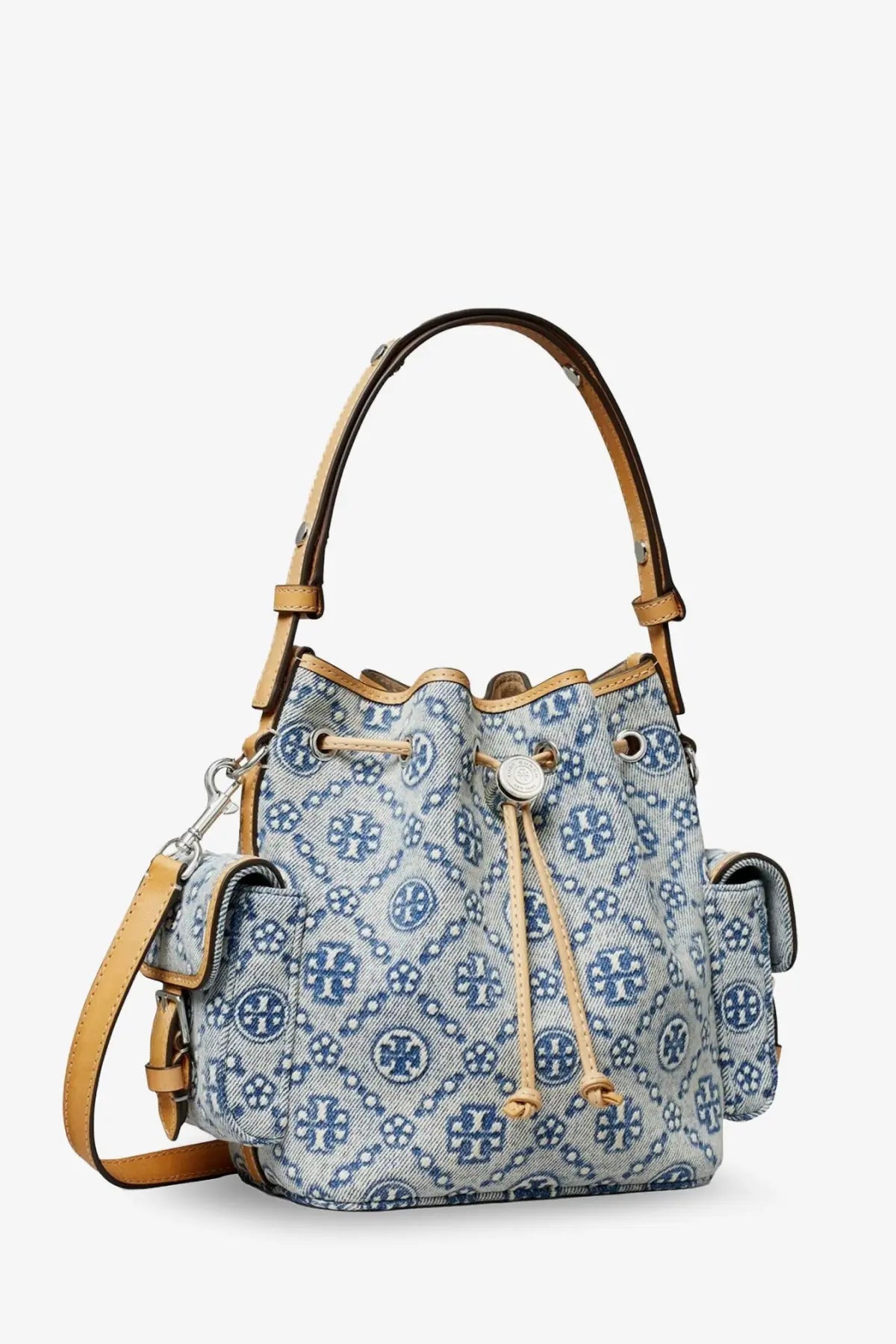 Tory Burch women’s blue monogram coated canvas bucket bag with navy logo pattern tan leather handles and drawstring closure