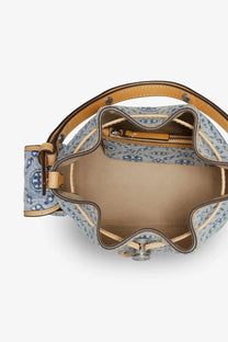 Tory Burch women’s blue monogram coated canvas bucket bag with light blue denim pattern and tan leather trim