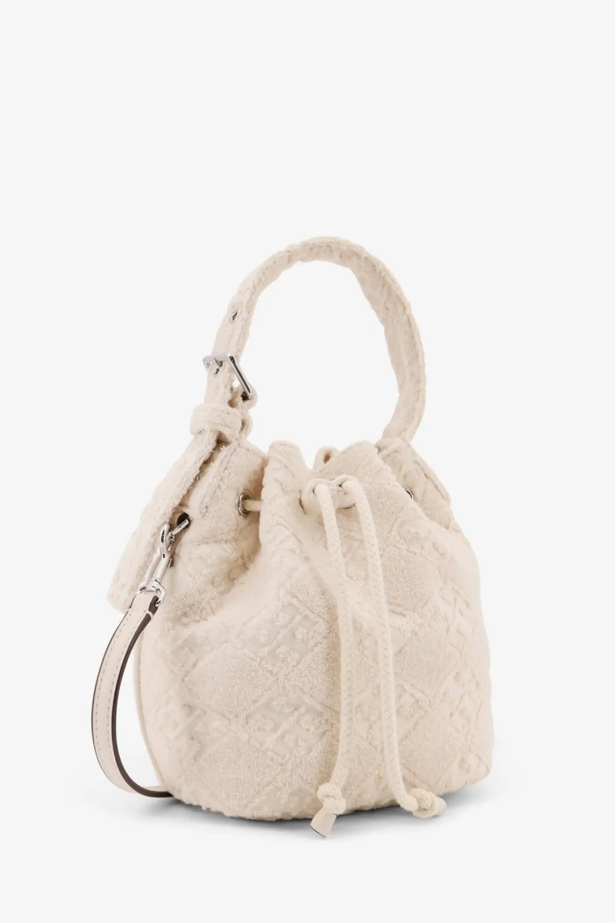Tory Burch women’s cream-colored monogram terry mini canvas bucket bag with textured fabric handle and drawstring closure