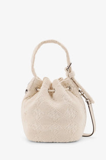 Cream-colored tory burch women’s monogram terry mini canvas bucket bag with textured drawstring closure and adjustable strap
