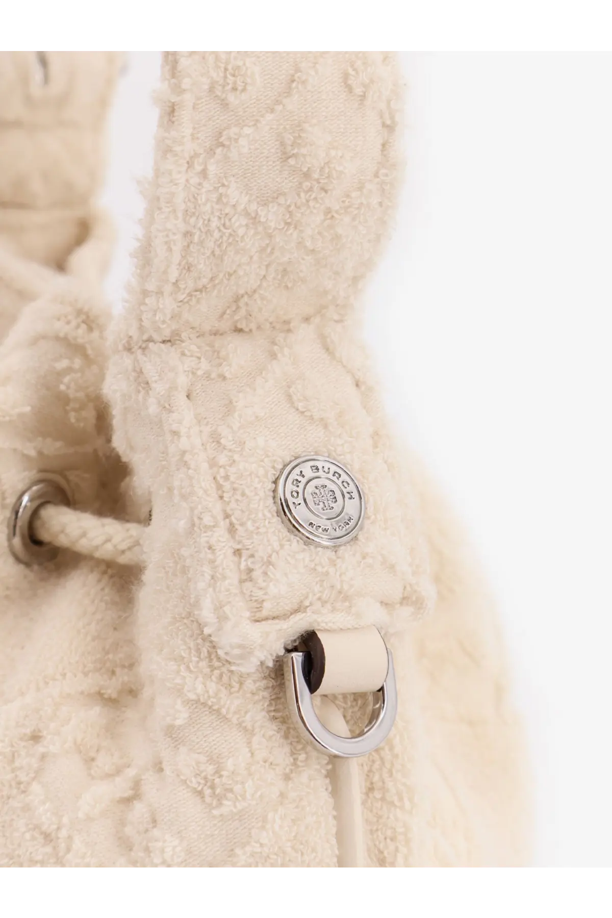 Tory Burch women’s cream textured fabric bucket bag with silver monogram logo button and metal ring hardware white
