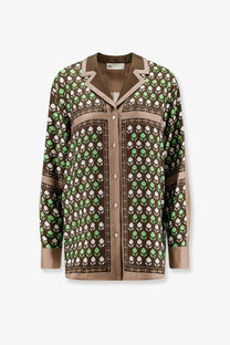 Tory Burch women’s long-sleeved silk blouse in rich olive green with light green and cream leaf pattern and beige trim