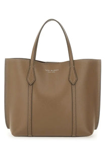 Tan leather tote bag with structured design and top handles from Tory Burch women’s Perry shopping bag brown