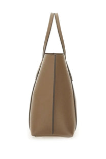 Tan leather tote bag with structured shape and matching handles Tory Burch women’s Perry shopping bag brown