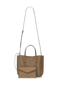 Tan leather Tory Burch women’s Perry shopping tote bag with sleek silver-tone hardware and matching envelope wallet