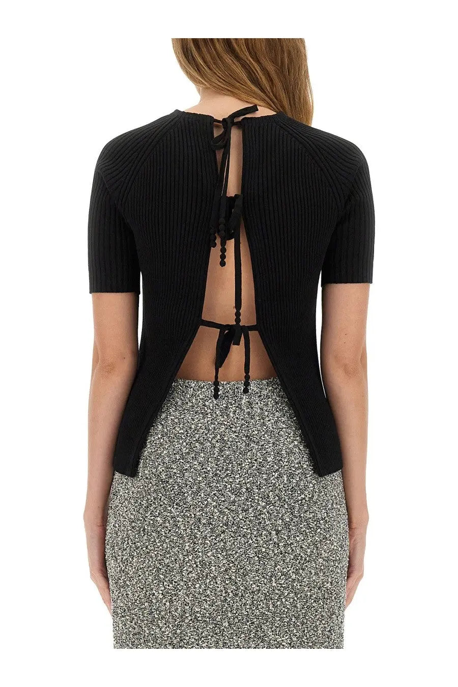 Back view of Tory Burch women’s black ribbed cotton short-sleeve pullover with tie detail at the back