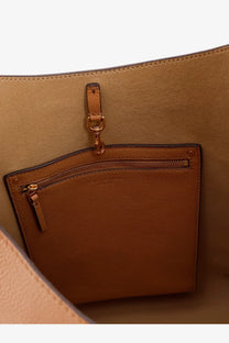 Tan leather interior pocket with gold-tone zipper and hardware in tory burch women’s romy hobo leather bag brown