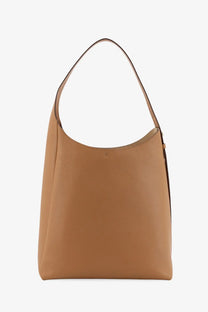 Tory Burch women’s Romy hobo leather bag brown with smooth pebbled texture and minimalist tan design