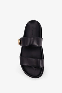 Black leather slide sandal with gold tone button closure from tory burch womens romy leather sandals black