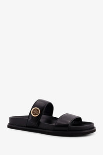 Black leather slide sandal with gold toned circular tory burch logo buckle for women