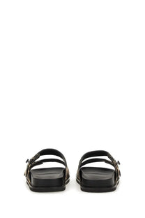 Tory Burch women’s black leather slide sandals with chunky sole and metallic buckle details
