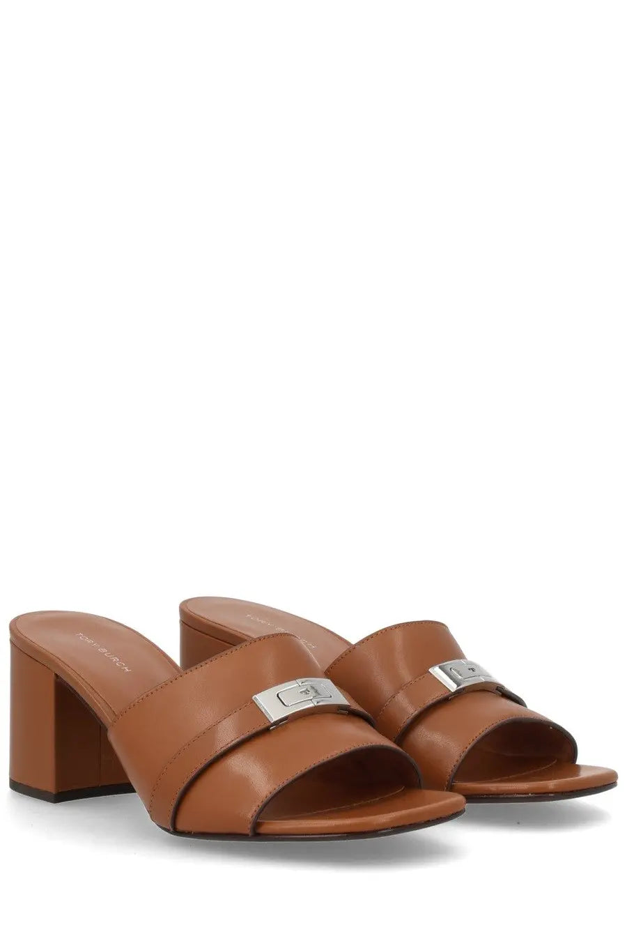 Tory Burch women’s brown leather mule sandals featuring a silver-toned rectangular buckle