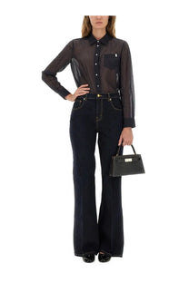 Black leather mini handbag with gold-tone hardware and structured rectangular shape shown with tory burch womens striped cotton shirt blue