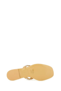 Beige leather flip-flop sandal by tory burch with thin strap adorned with small metallic studs