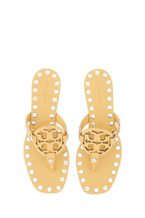 Beige leather tory burch women’s studded miller sandals with silver toned studs and signature logo medallion