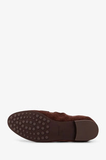 Tory burch women’s black suede loafer with brown textured rubber sole featuring circular studs