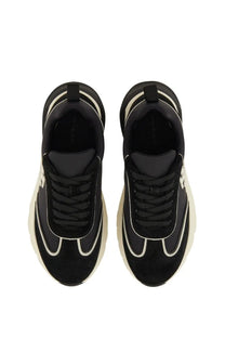 Tory Burch women’s trainer good luck black chunky sneakers with cream suede upper white stitching and bold rubber sole