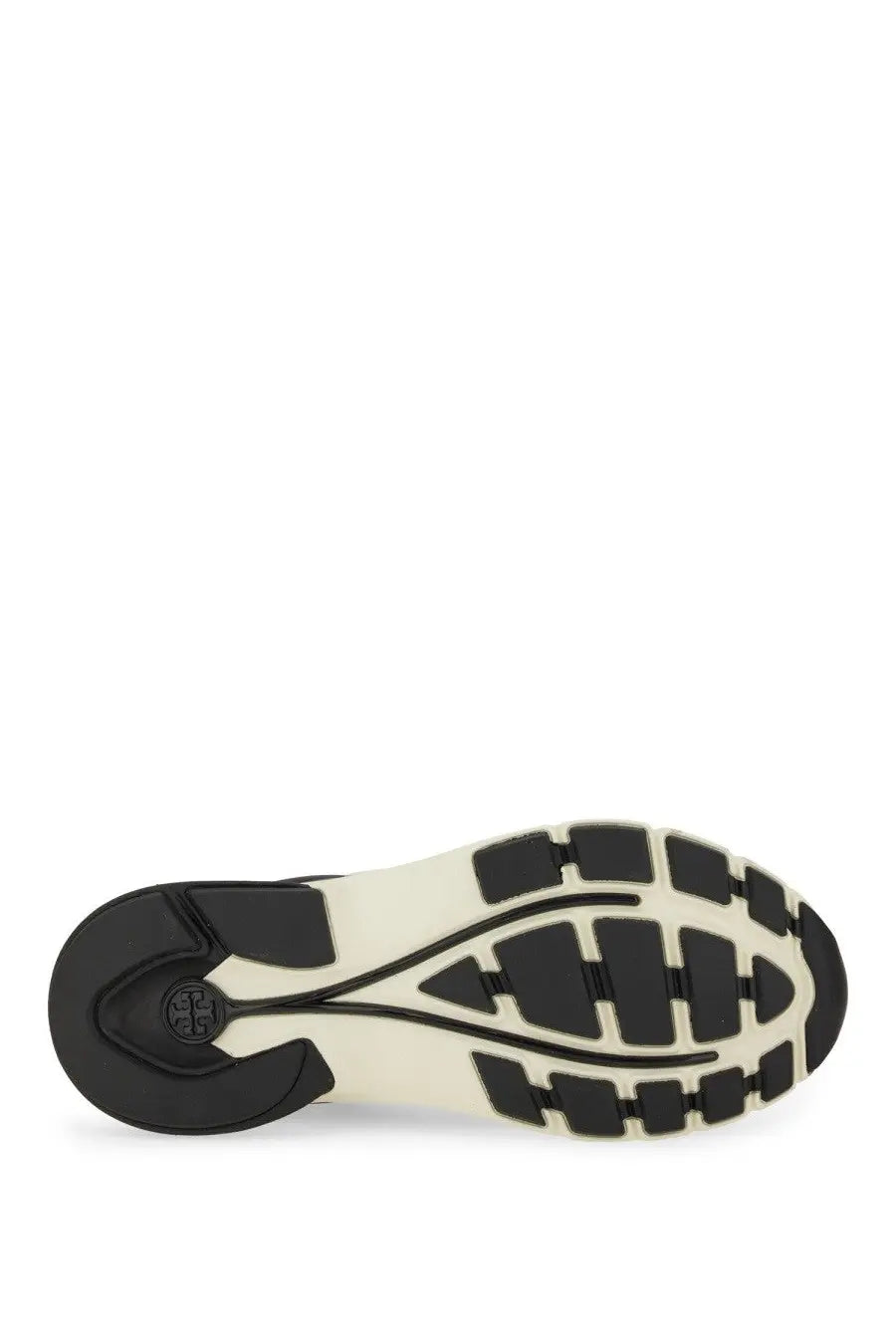 Black and cream-colored rubber sole with a geometric tread pattern on the Tory Burch women’s trainer Good Luck Black