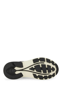 Black and cream-colored rubber sole with a geometric tread pattern on the Tory Burch women’s trainer Good Luck Black