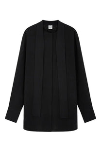 Toteme women’s black long-sleeved blouse with draped front and subtle pleats in a minimalist design