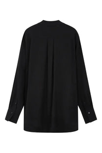 Toteme women’s black oversized blouse with long sleeves and subtle pleated back shown from the back side