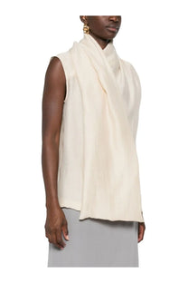 Toteme women’s blouse pink styled as a cream-colored silk scarf worn as a sleeveless top