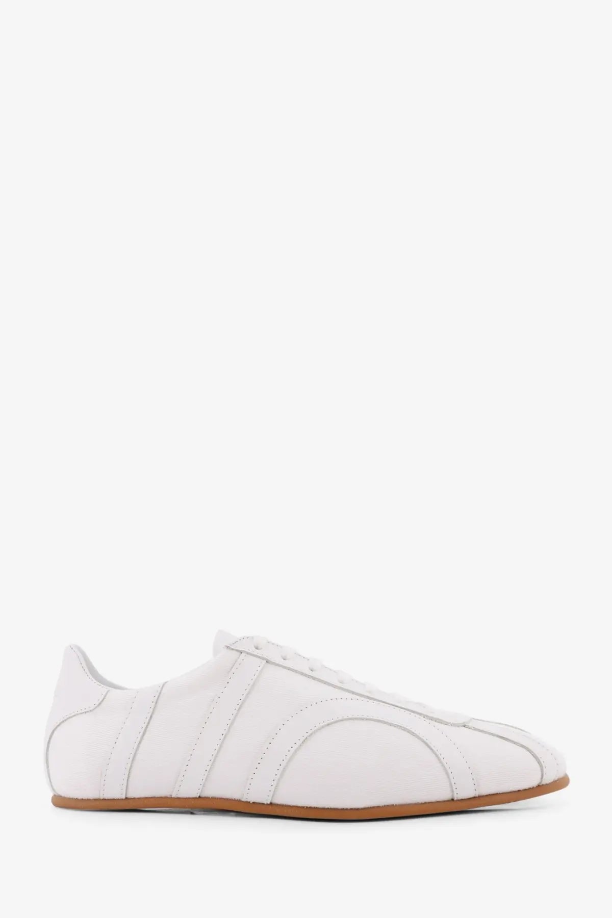 Toteme women’s canvas low top sneakers in white leather with minimalist design and tan rubber sole