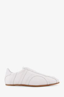 Toteme women’s canvas low top sneakers in white leather with minimalist design and tan rubber sole