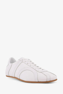 Toteme women’s canvas low top sneakers in white leather with subtle stitched paneling and tan rubber sole