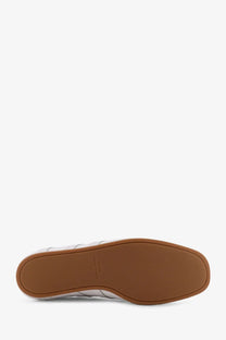 Toteme women’s white canvas low top sneaker with white leather upper and tan rubber sole front view