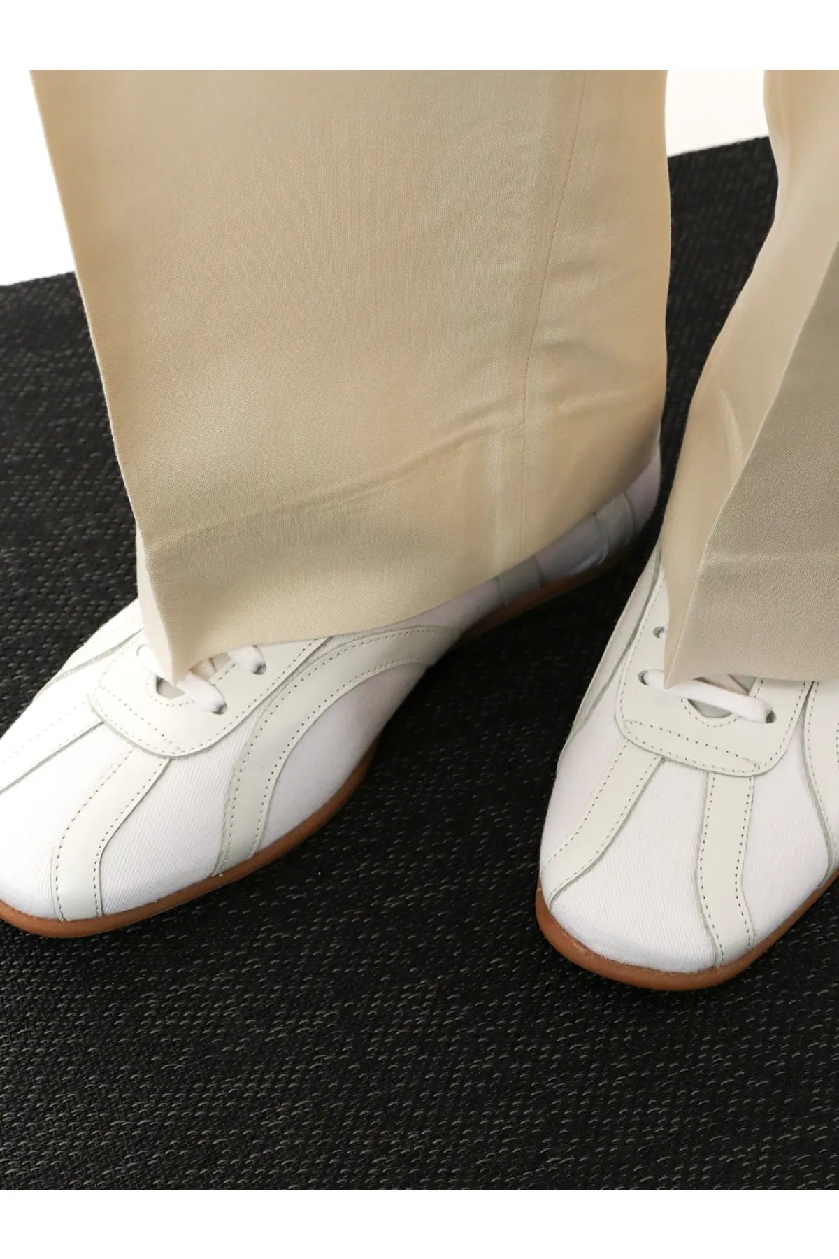 Toteme women’s canvas low top sneakers in white leather with tan rubber soles and subtle stitching details