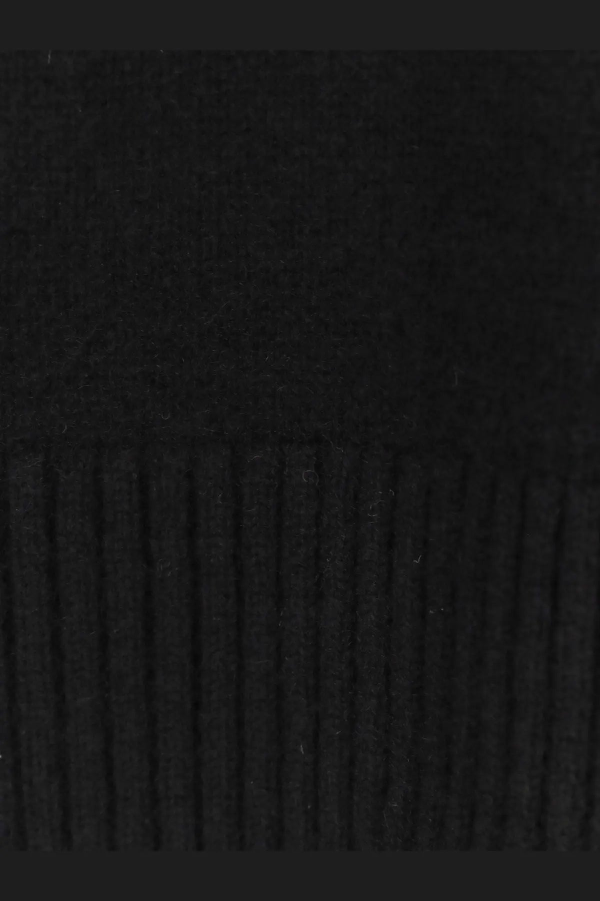 Toteme women’s cashmere turtleneck in black shown in ribbed knit fabric with textured vertical striped pattern